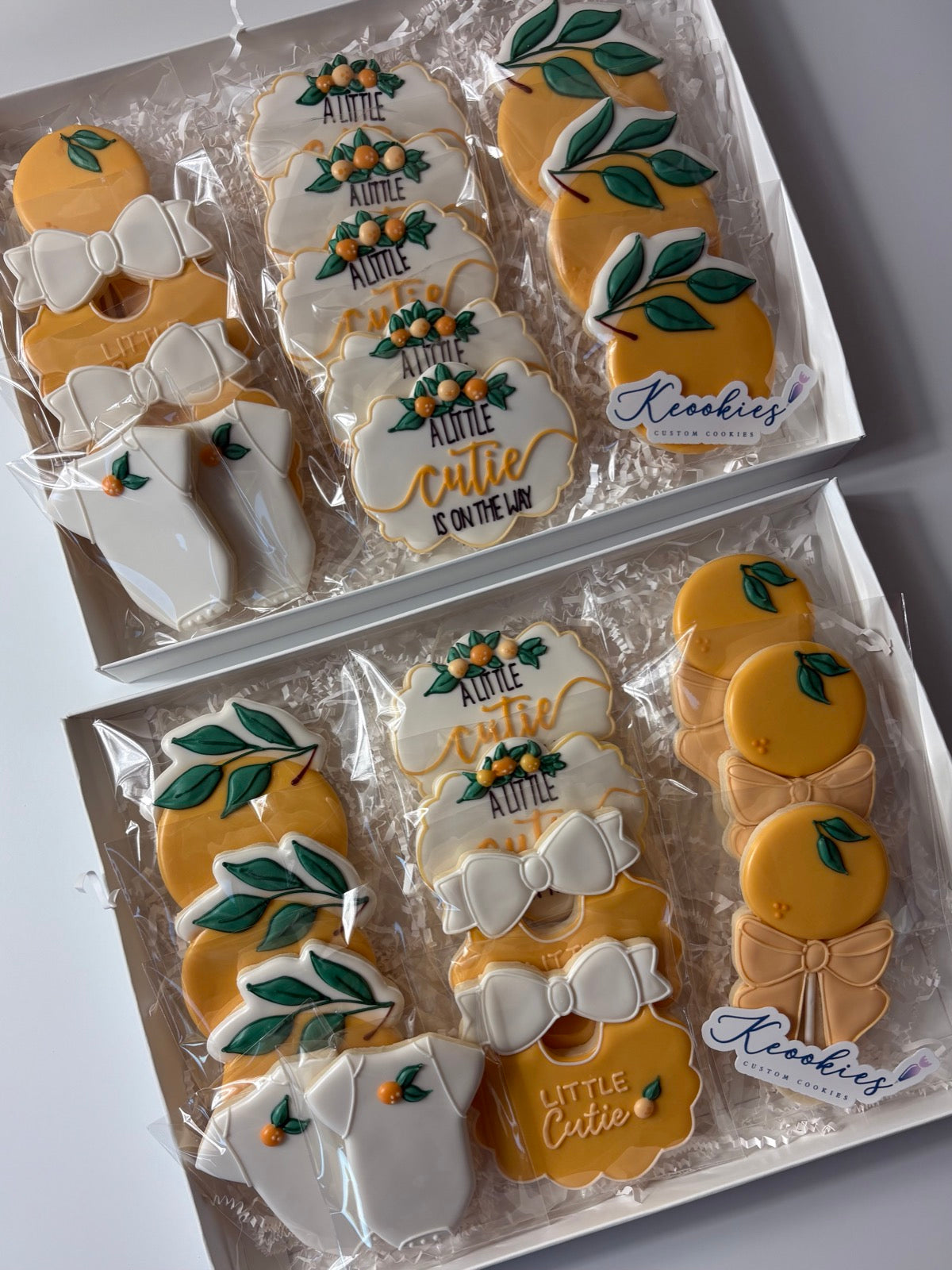 Two gift boxes of custom Keookies baby shower cookies