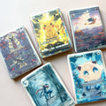 Pokemon card cookies: five trading-card designs printed on royal icing, including Pikachu, Charizard and Jigglypuff